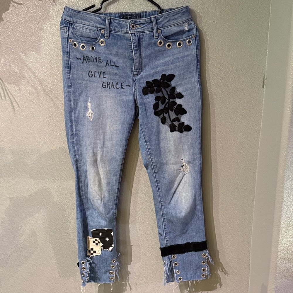 Custom embellished jeans. Grommets, lace, patches, Lucky size 8 jeans.
